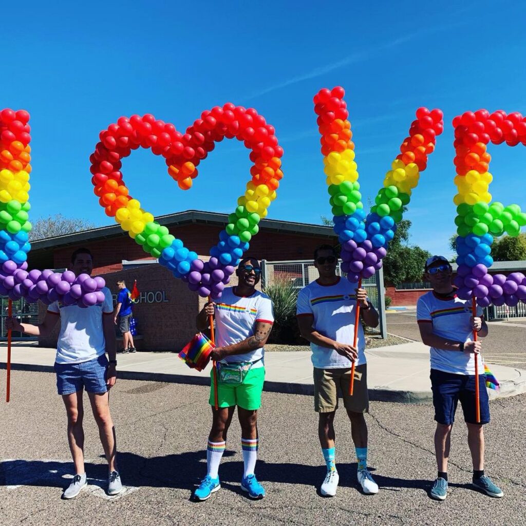 Balloon letters on poles for pride parade
