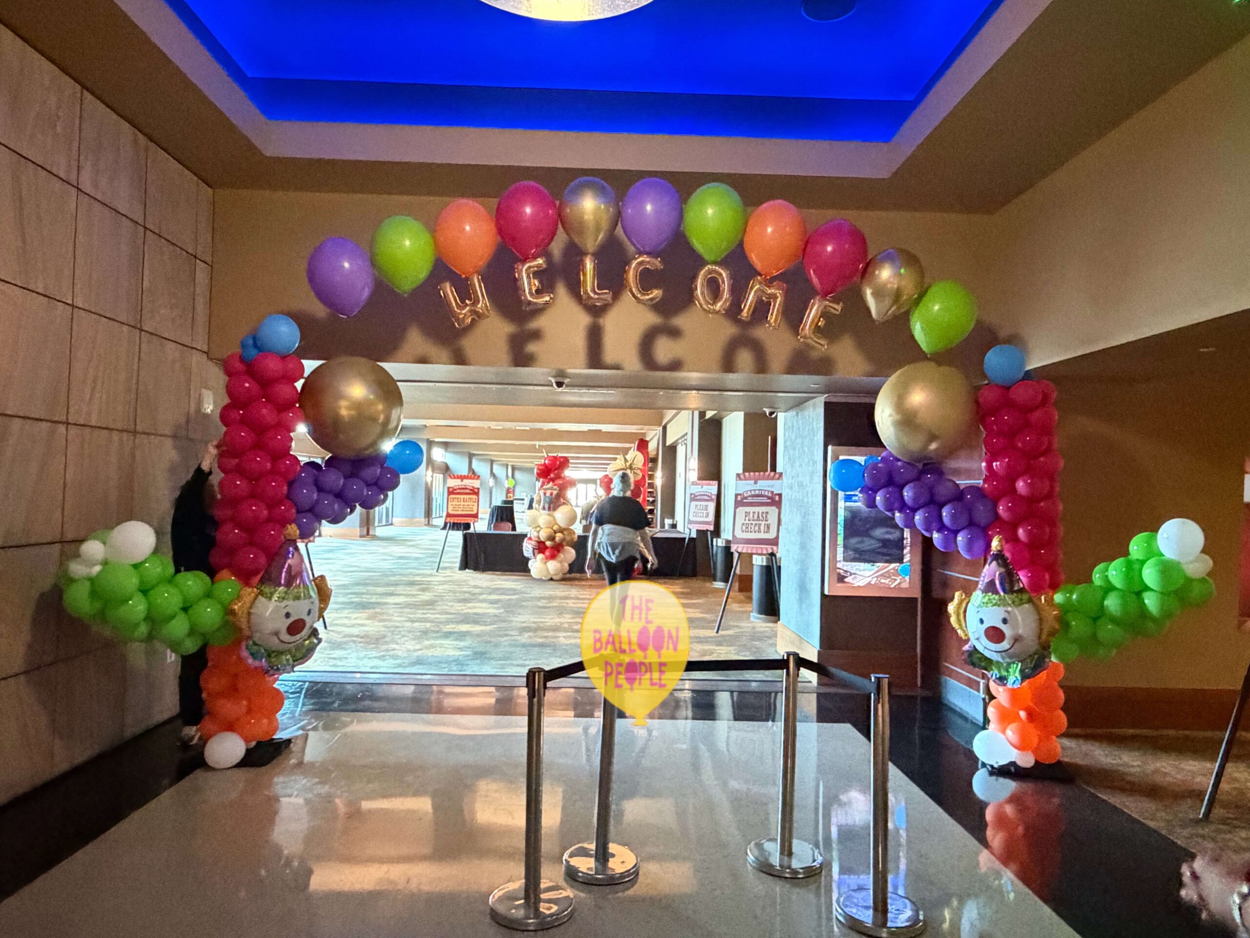 Circus themed entry, grand entrance to a carnival event, clown arch