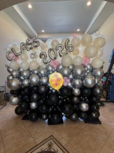 Graduation balloon wall with text grad 2026