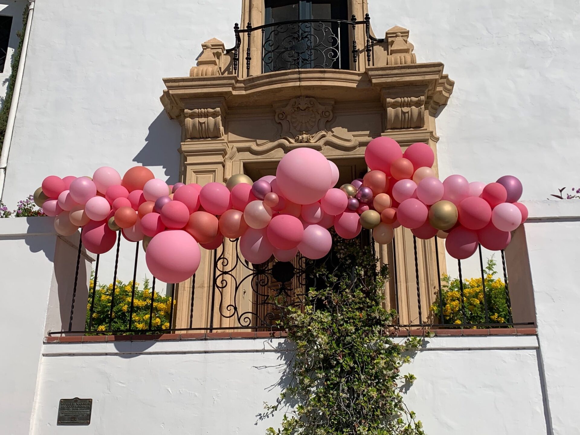 Balloon Garlands on a balcony railing