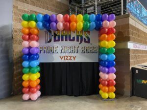 square Balloon Arches frames a sponsor's sign