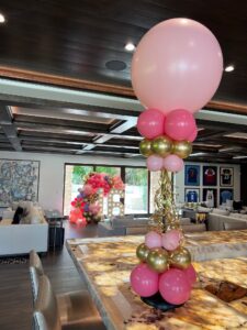 pink and gold Balloon Centerpieces with gold curling ribbon accents