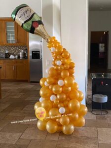 champane pouring out of a bottle made of Balloons