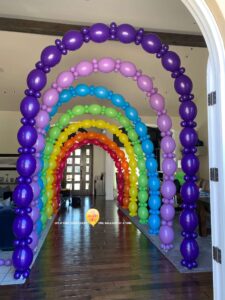 delicate Balloon Arches create a tunnel effect for a party