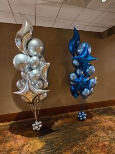 matching Balloon Centerpieces with Balloon Floor Bouquets provides a cohesive look throughout the event