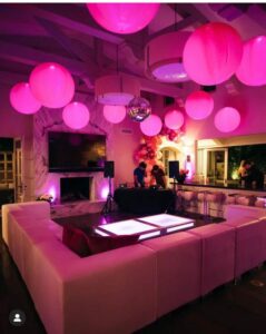 consider lighted Balloons on a ceiling instead of Balloon Centerpieces. A great choice when seating is casual and not at tables