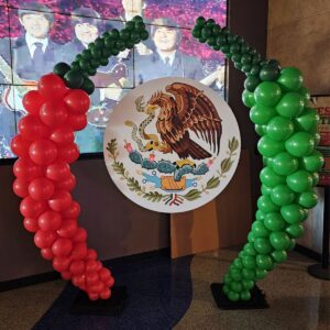 celebrating Mexico with giant Balloon chiles and the Mexican flag emblem
