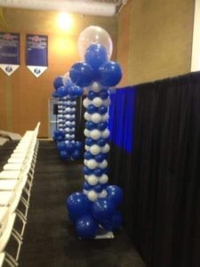 sculpted Balloon Columns with double bubbles on top decorate a room