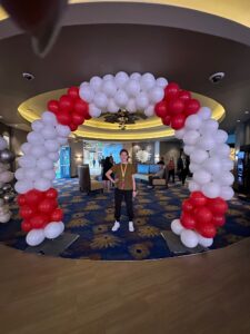 Horse shoe shaped Balloon Arches in red and white