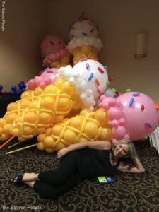 Balloon ice cream cones on poles to be carried in a parade