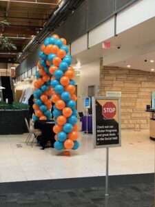 zig zag Balloon Arches at a convention registration table arizona
