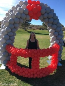 outdoor Balloon Arches in the shape of a football helmet