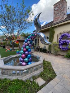 mermaid tail coming out of a small pond