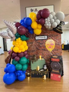 Harry Potter themed balloon garland backdrop for corporate event