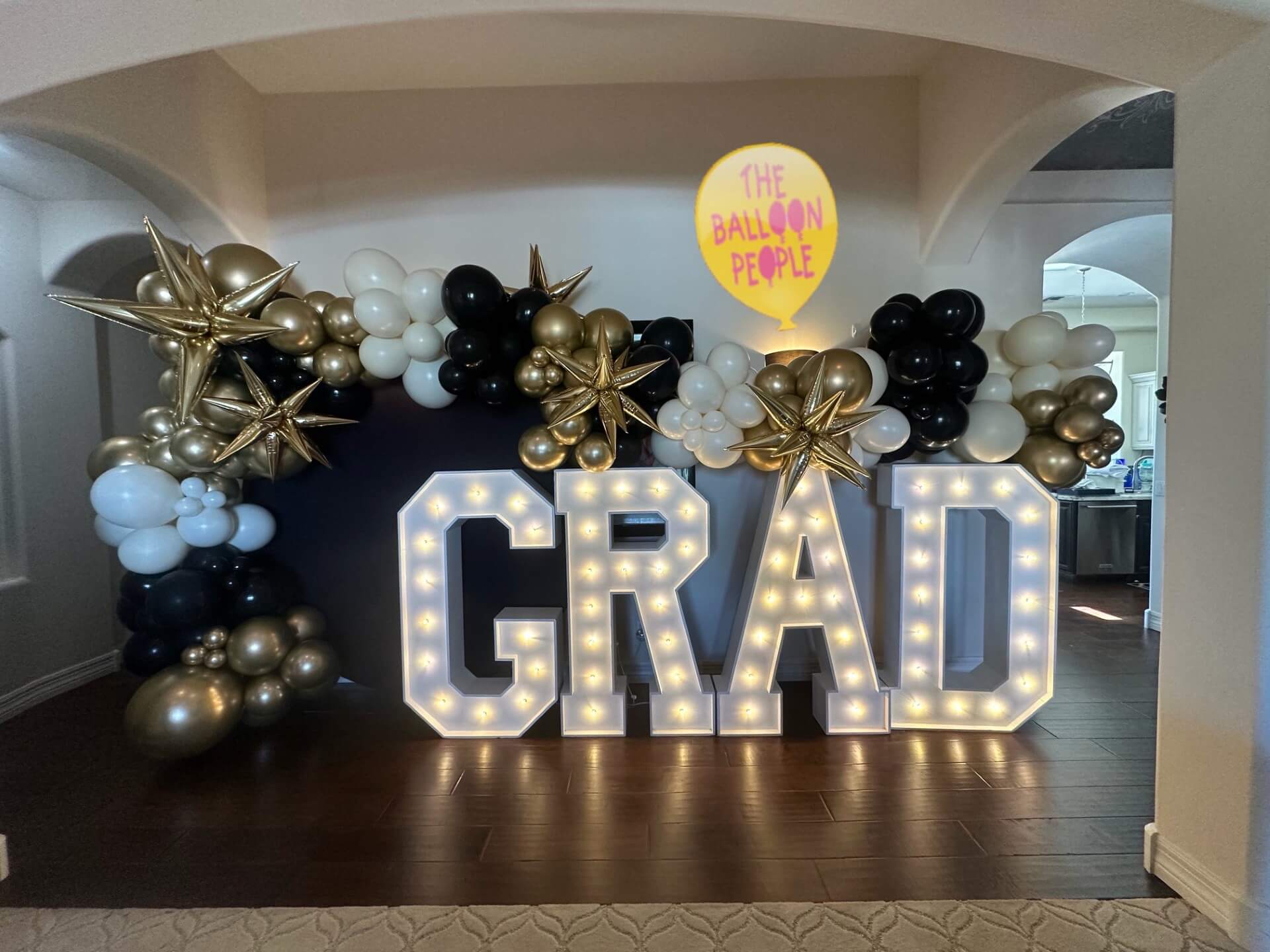 Balloon garland hoop with marquee letters for graduation