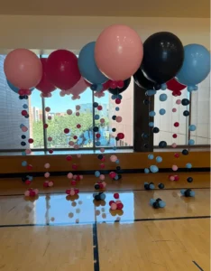 balloon columns with different sized balloons coming down