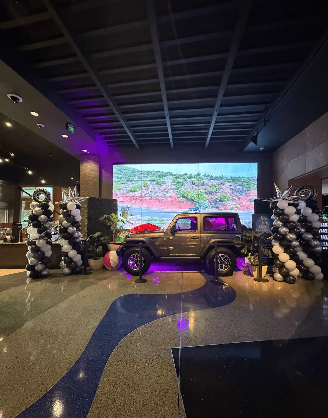 balloon columns flanking a car to win